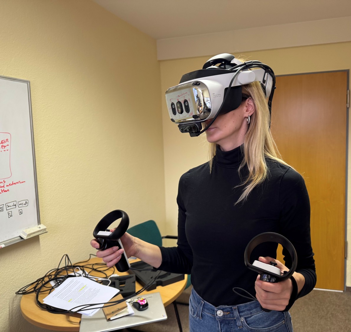 Researcher using a virtual reality headset and controllers
